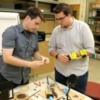 Eric Thomas, left, works with fellow student Jordan Nickerson in Sylvania's MakerSpace.