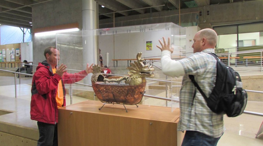 The Sylvania Campus Traditions, Rituals and Fun Committee decided to use a dragon boat shape as the vessel, to place 50 items inside the capsule, and to designate that it should be opened 50 years later, in 2062