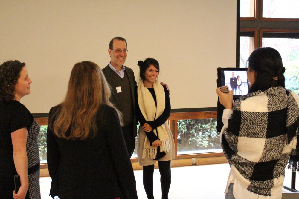 Students gather to take photos with Senator Michael Dembrow.