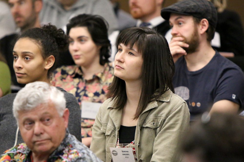 Serena Dressel, a volunteer coordinator with Portland State University's Student Sustainability Center, listens to PCC's Briar Schoon's overview of the college's green programs.