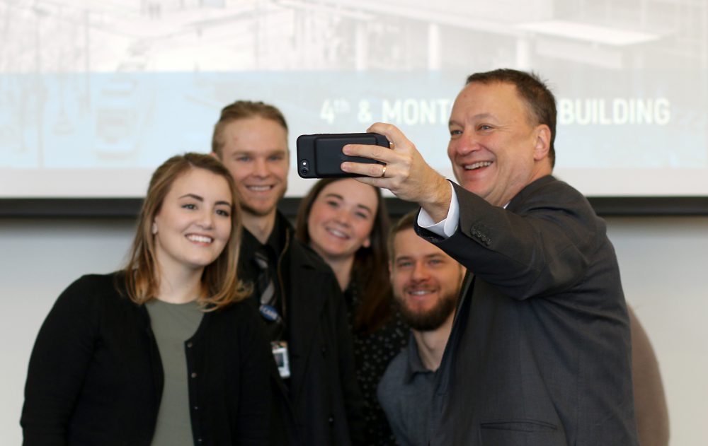 David Bangsberg, dean of joint PSU/OHSU School of Public Health, poses for a selfie with his students.