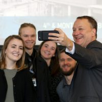 David Bangsberg, dean of joint PSU/OHSU School of Public Health, poses for a selfie with his students.