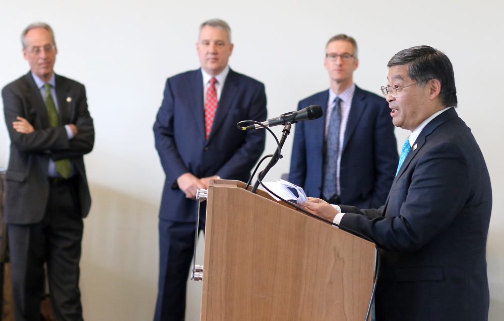 PCC President Mark Mitsui talks to reporters about the impact of the historic collaboration as PSU President Wim Wievel, OHSU President Joseph Robertson and City mayor Ted Wheeler look on.