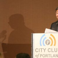 President Mitsui speaking at a podium