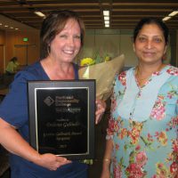 Dolores Galindo (left) with business instructor Usha Ramanujam.