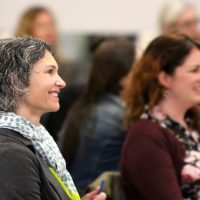 Sylvania's Dean of Student Services Heather Lang enjoys the keynote at the conference on culturally responsive teaching.