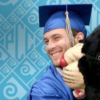Student hugging Poppie at graduation