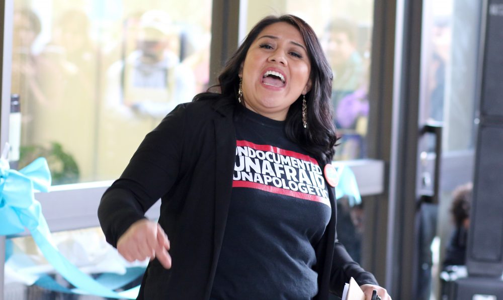 Petrona Dominguez excites the crowd with chants.