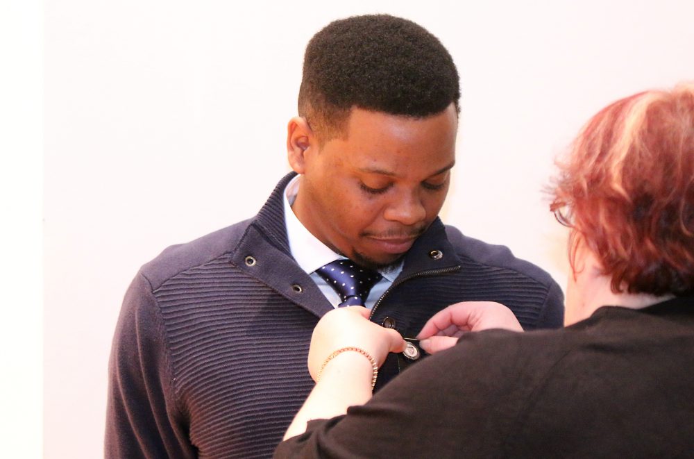 J'amartay Bentley gets his nursing pin.