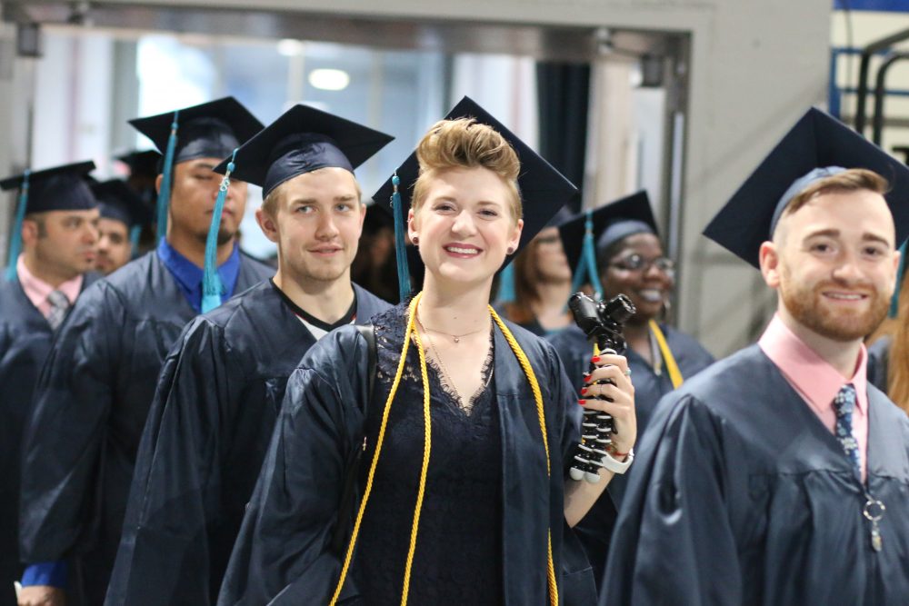 When the graduates first enter the coliseum, it's hard for them to contain their enthusiasm.