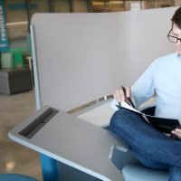 Student studying outside a resource center