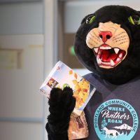 Poppie holding non-perishable food