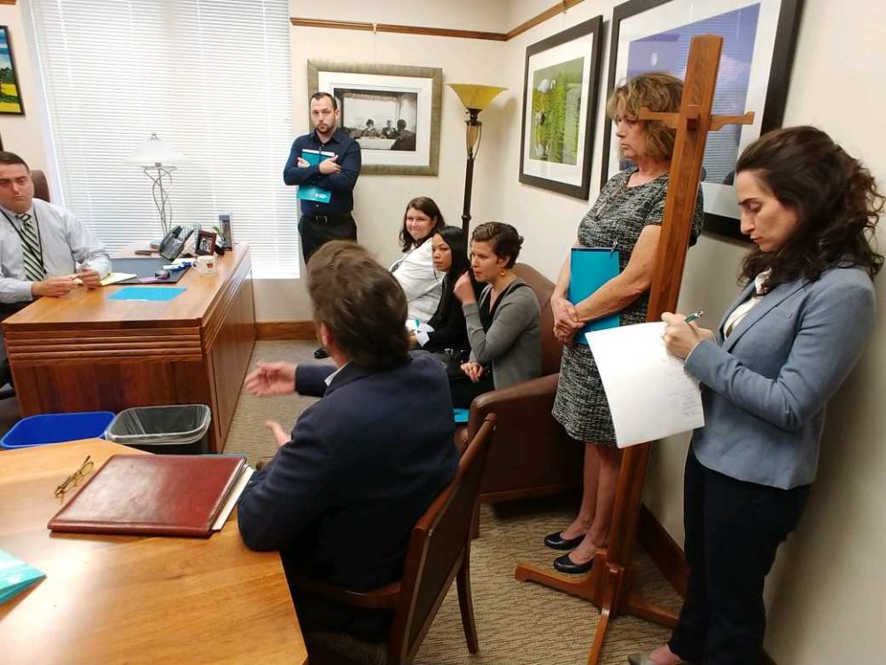 Emma Kallaway takes notes at leg visit.