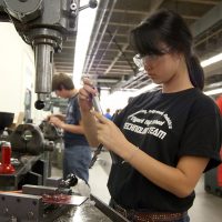 Girl in machine lab.