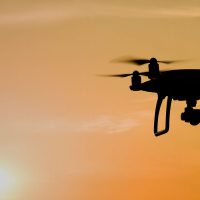 Drone flying in the sunset