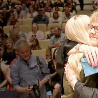 Jolie Manning hugs nursing grad.