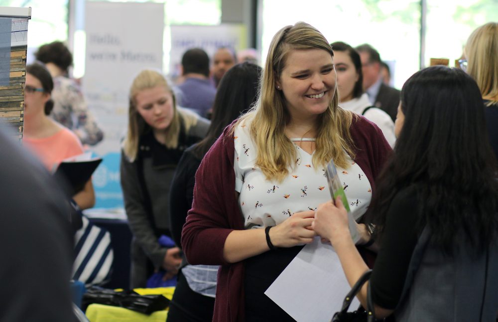 People at PCC Job Fair interacting.