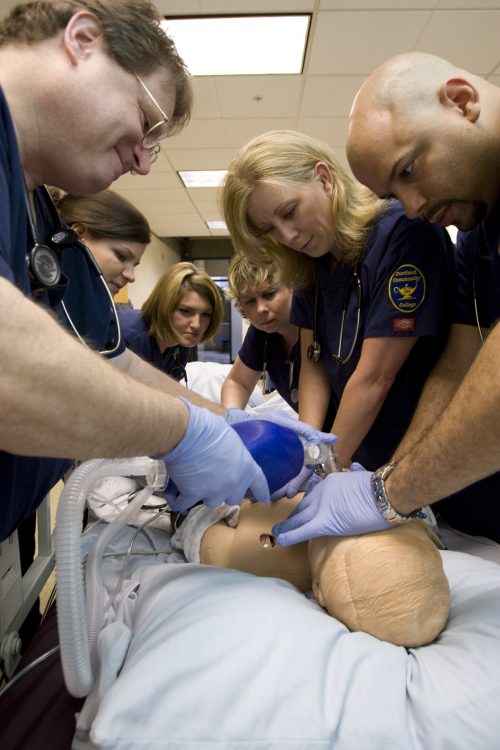 Group of students working on mannequin