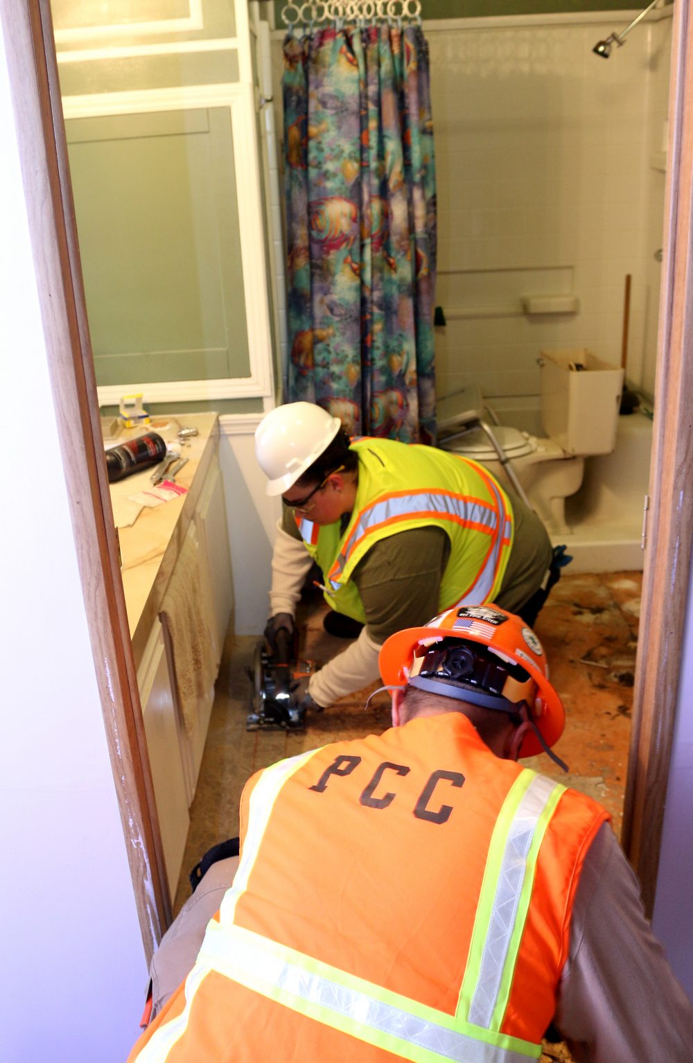 Students fixing mobile home.