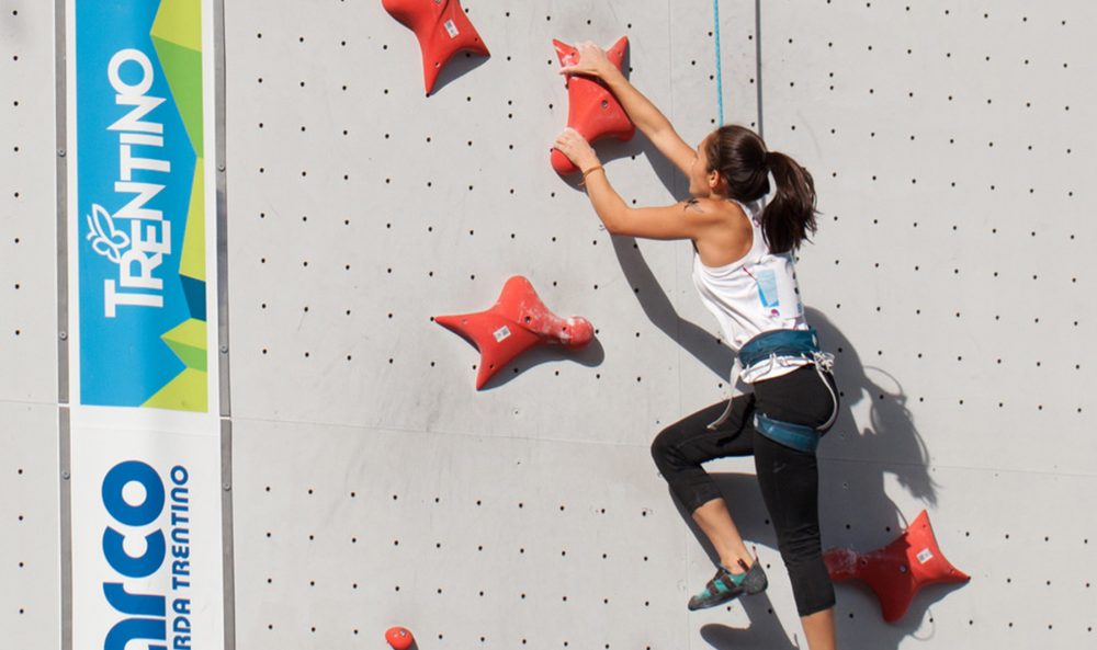 Sonja climbs wall.