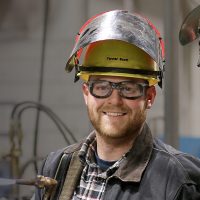 Tanner and Matt Scott in welding shop.
