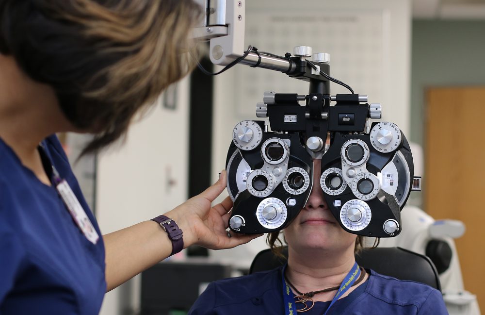 Testing a patient's eyes.