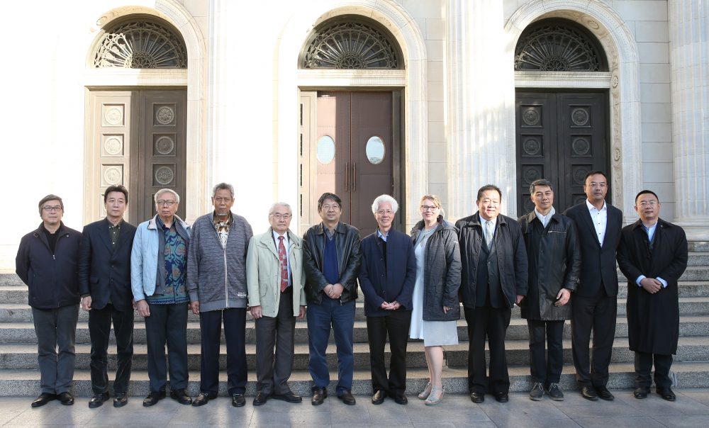 Heidi Sickert poses with symposium guests in China.