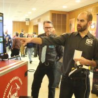 Tony Yorba shows paint machine.