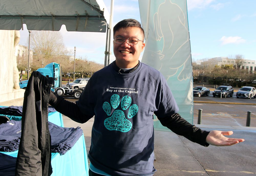 student shows off t-shirt