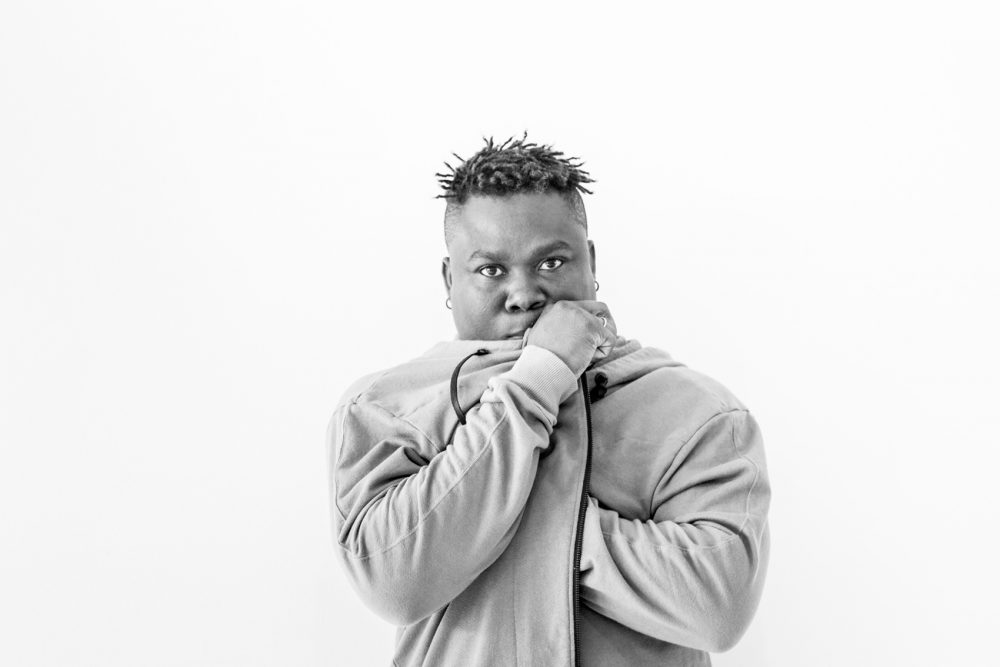 man standing against white background