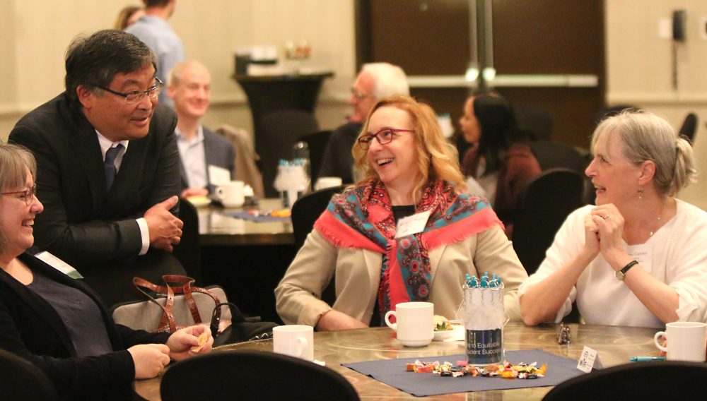 PCC President Mark Mitsui chats with staff at the YESS Summit this spring.