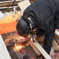 Jess welders steel together.