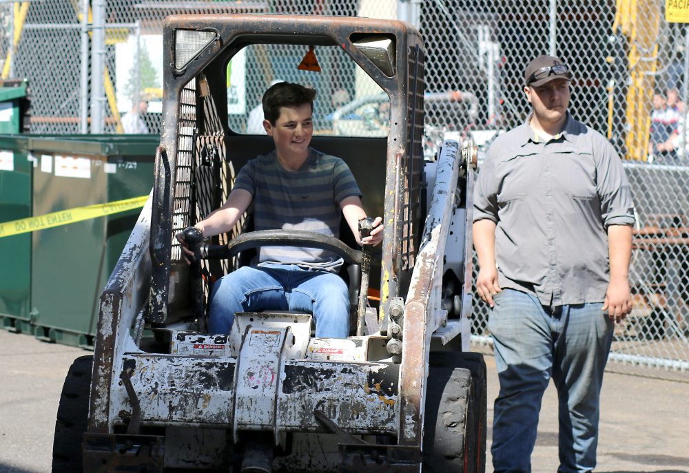 Bobcat steer piloted by student.
