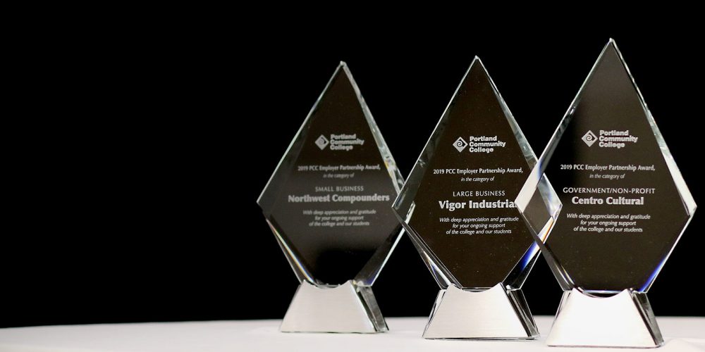 Awards against black backdrop