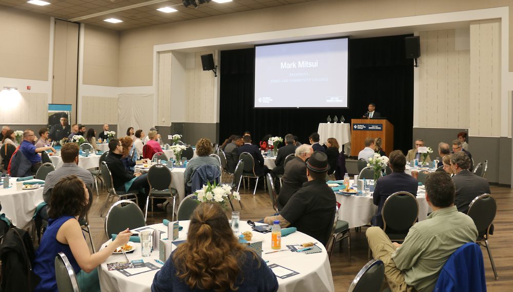 Mark Mitsui speaks to the crowd.