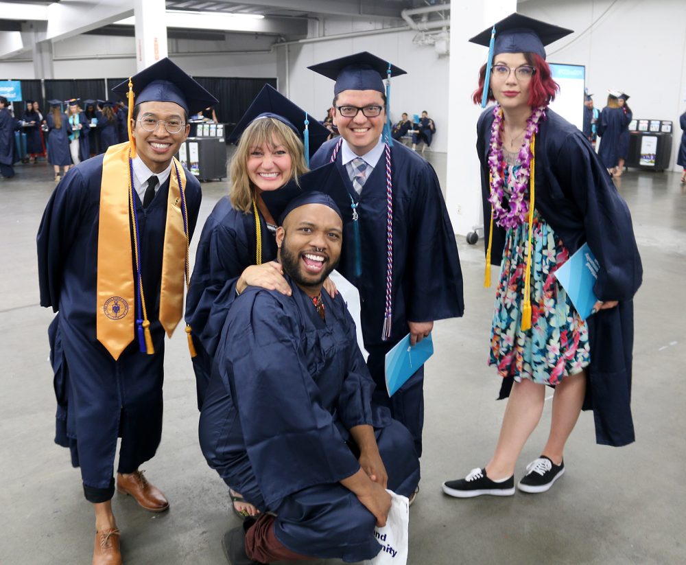 Graduates posing in fun zone area.