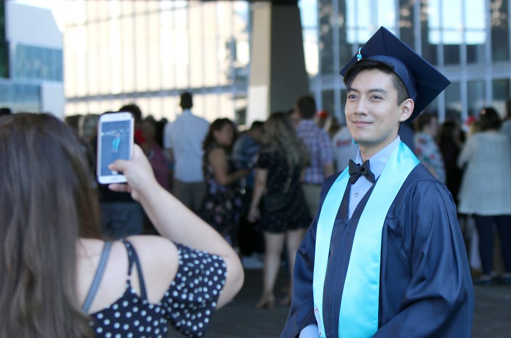 Grad outside with mother.