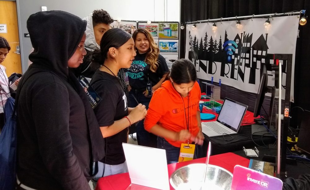 People visit the Team Vend Renter booth.