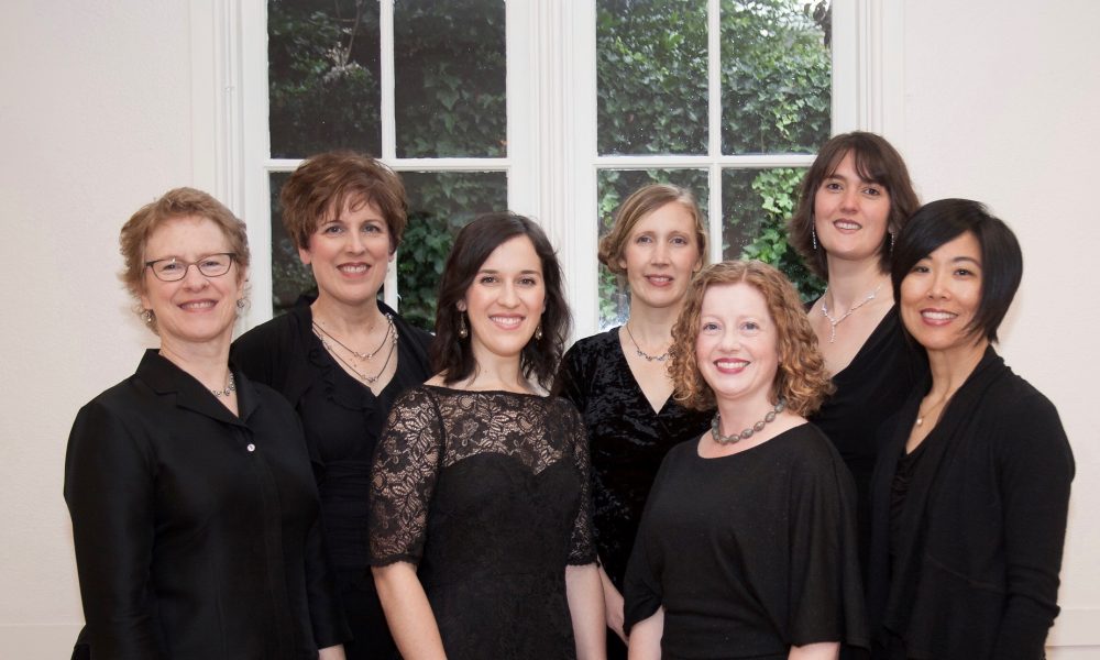 six women in black dresses