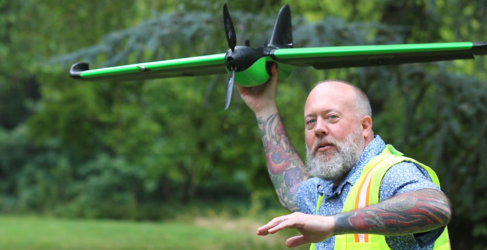 Mike Holscher with fixed-wing drone.