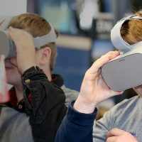 Two students enjoy their virtual training goggles