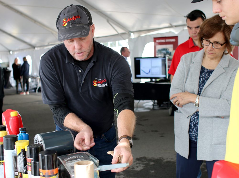 Suzanne Bonamici checks out a new kind of oil for machines.