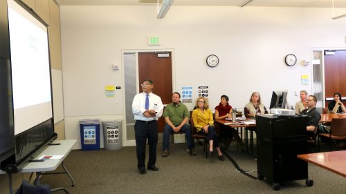 President Mark Mitsui shares his work plan with college staffers.