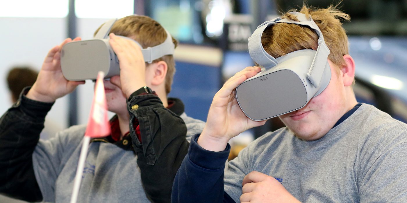 Two students enjoy their virtual training goggles.