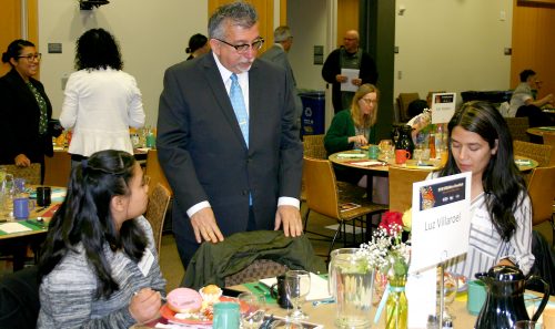 Rock Creek Campus President Chris Villa chats with attendees.