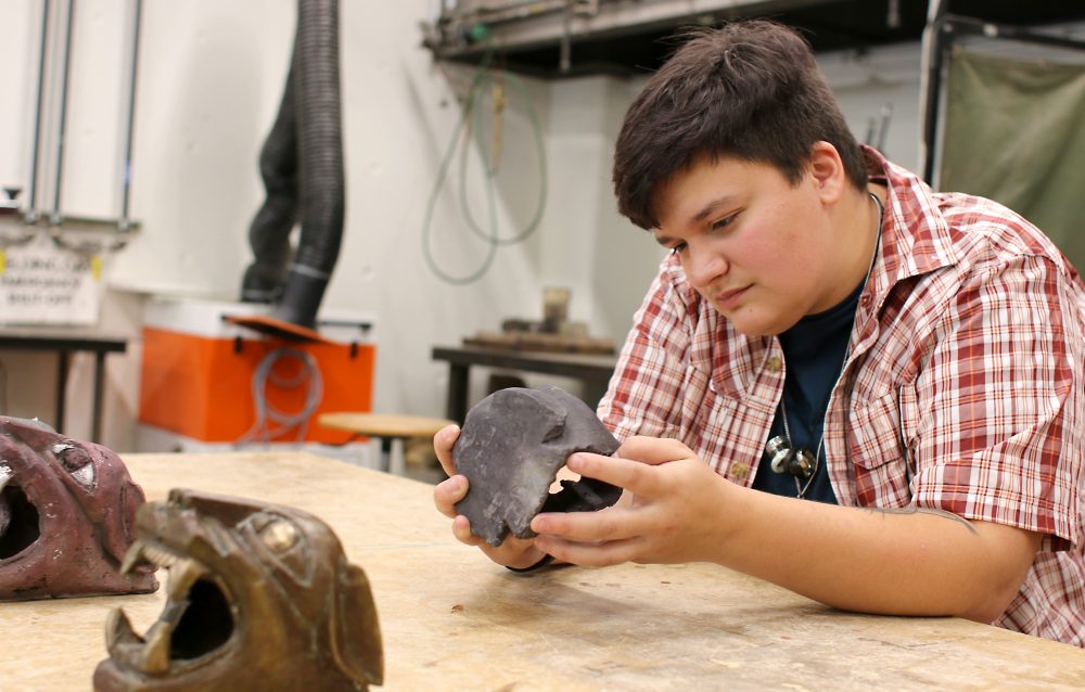 Hal Shaw looks at their Panther heads.