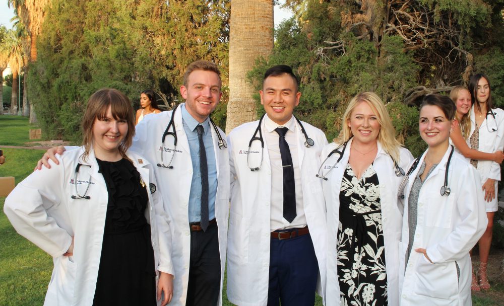 Britt Gratreak (left) at her white coat ceremony.