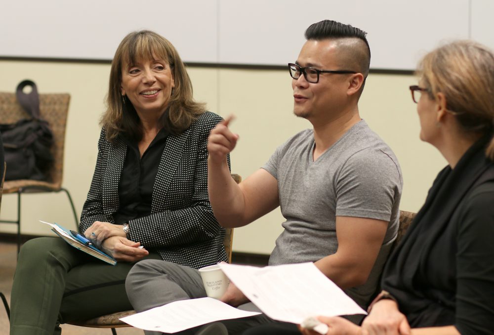 Sylvia Kelley listens to a staff member discuss strategic planning.