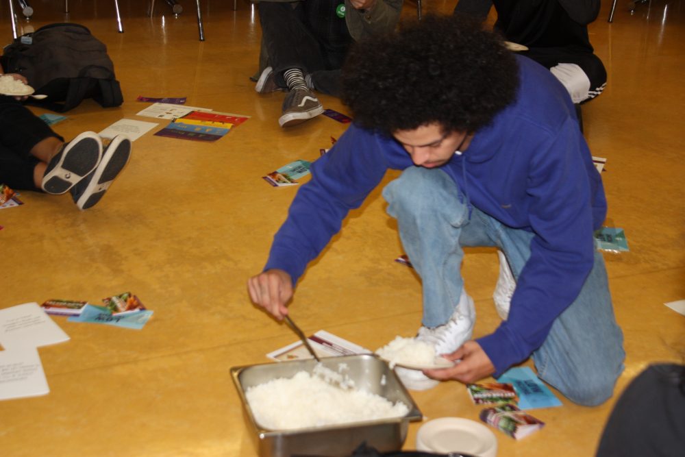 Picture of student serving themselves rice