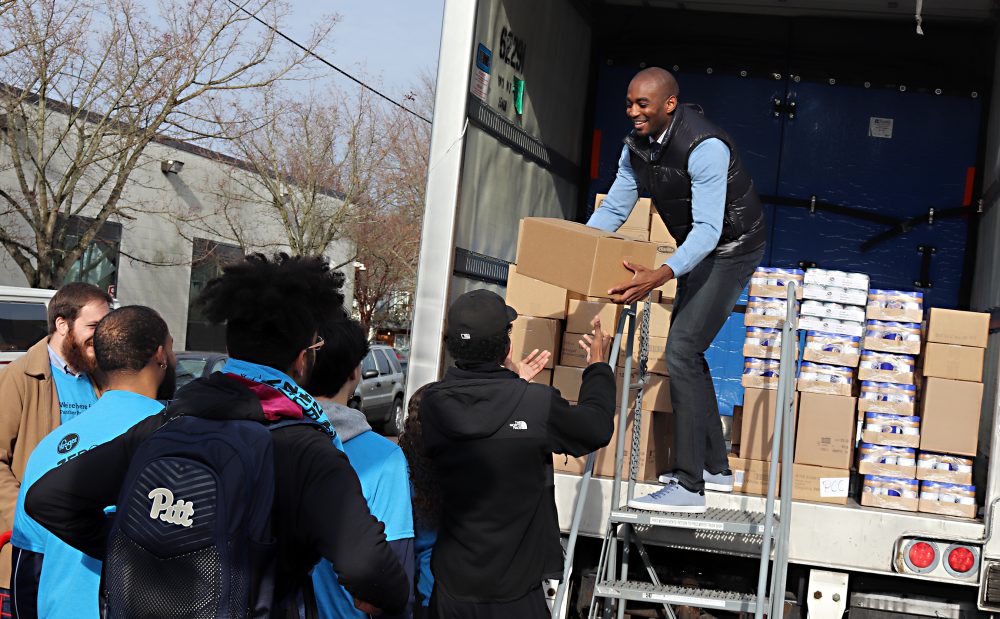 Lamar Hurd unloads some food.